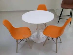 Round Dining Table With Eames Chairs-White^Orange