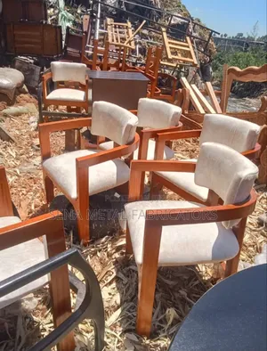 Dining Chairs With Cream Upholstery, Custom-Made With Mahogany Wood.