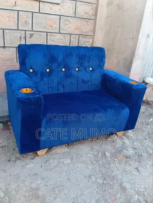 A Blue 2 Seater Sofa