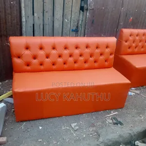 Orange Couches With Black Buttons