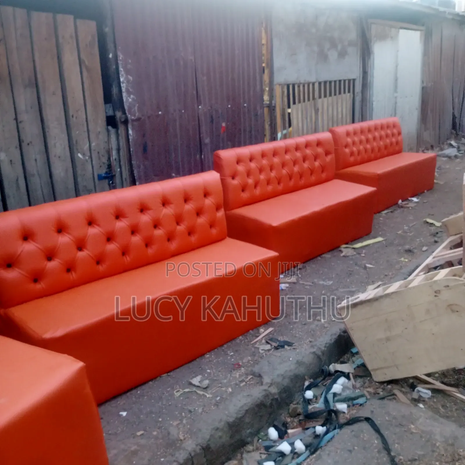 Orange Couches With Black Buttons