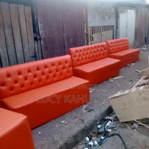 Orange Couches With Black Buttons