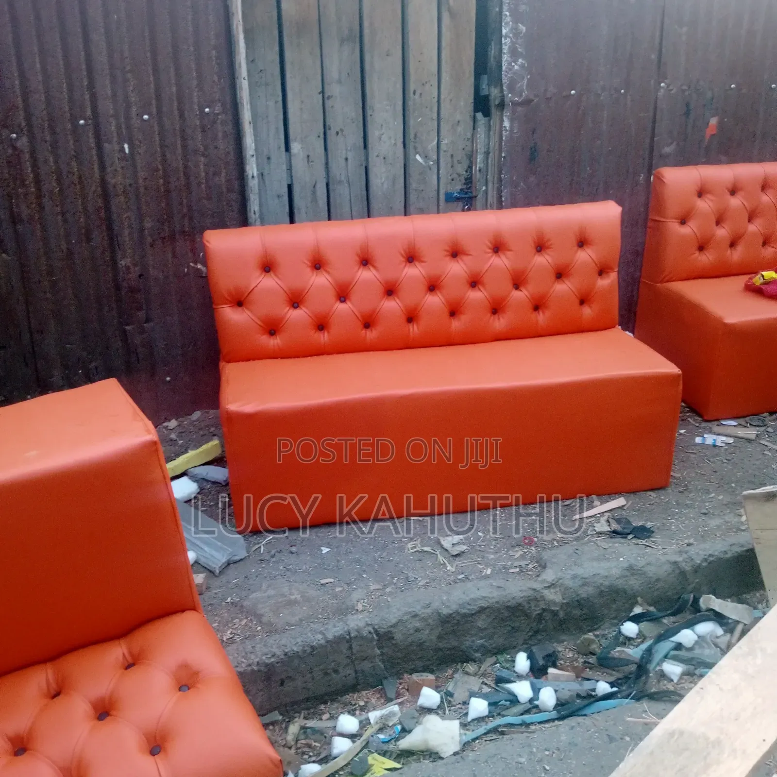 Orange Couches With Black Buttons