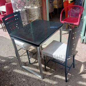 Grey Marble Top With Mabati Laser Cut Chairs