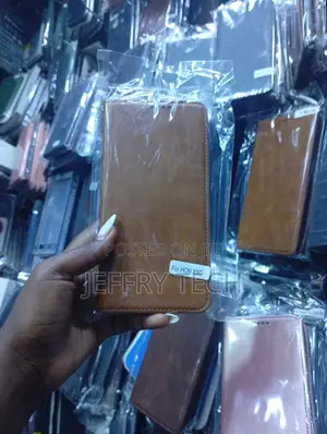 Brown Leather-Style Wallet Flip Case for the Honor X6c Smartphone.