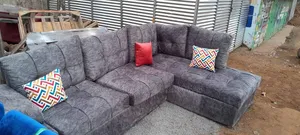 Brand New L-Shaped Sofa Color Grey.