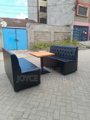 A Set of 4 Seater Restaurant Couch and a Wooden Table 