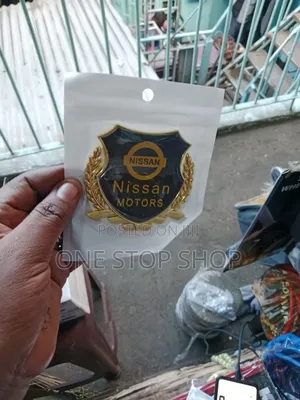 Nissan Motors Badge With Laurel Style Golden Wreath Wheat Ears on Side