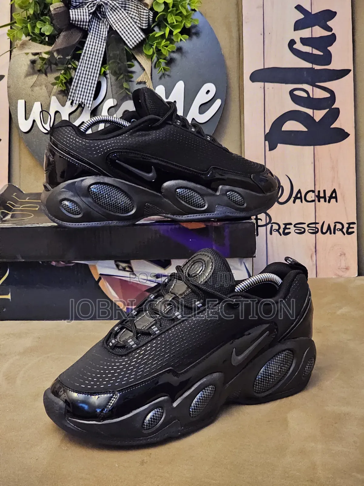 All Black Nocta Glide Sneakers
