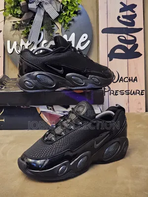 All Black Nocta Glide Sneakers