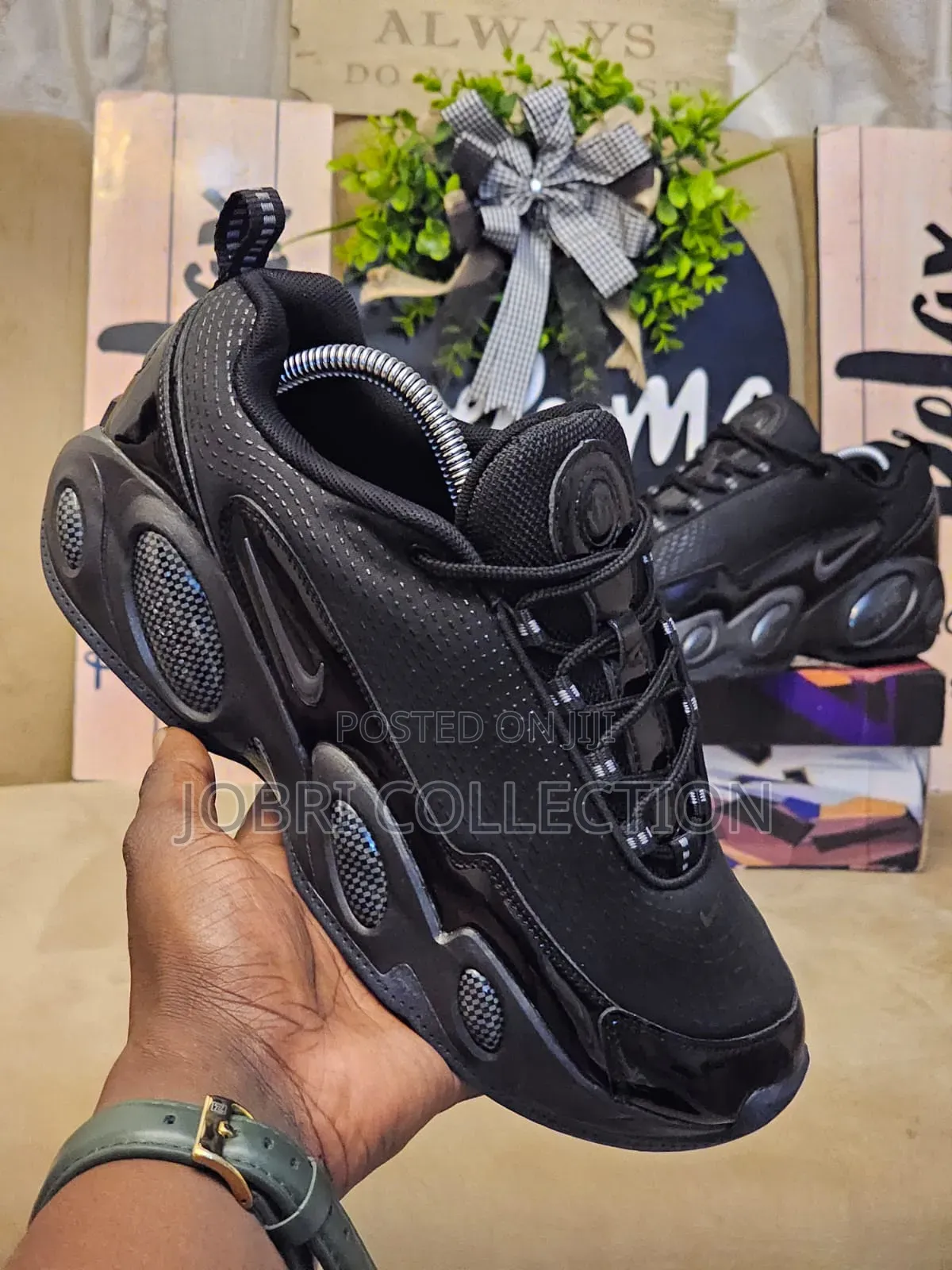 All Black Nocta Glide Sneakers
