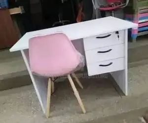 Vintage Office Desk With Pink Eames Chair