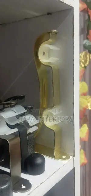 Gold Double Brackets For Curtain Rod Installation