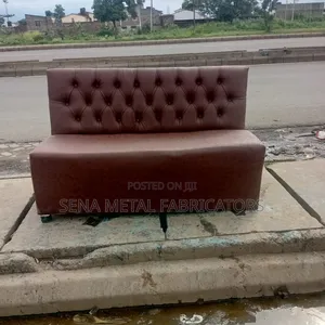 Brown Couch With Patterned Faux Leather.