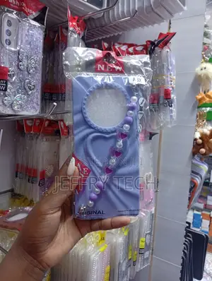 Oppo A3x Wavy Border and a Matching Beaded Heart Charm Strap Case