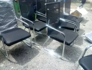 A Black Mesh Visitors Office Chair With Cantilever Frame