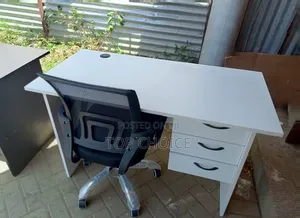 White Table and Mesh Chairs.