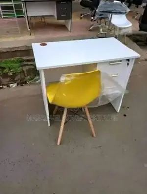 Yellow Eames Office Chair and White Table