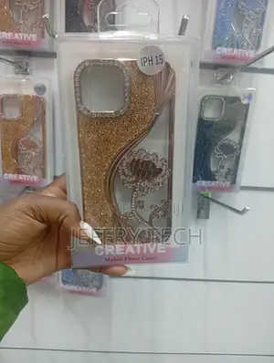 iPhone 15, Featuring Glitter, Crystals, and a Floral Design Case