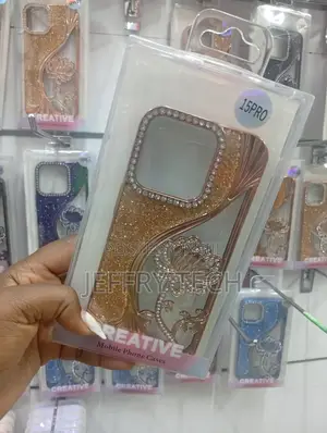 iPhone 15 Pro, Featuring Diamond-Like Studs and a Floral Pattern.