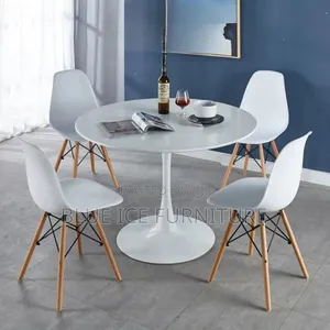 Round White Table With 4 Eames Chair