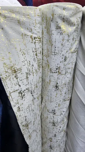 Offwhite Curtains With Gold Prints for Cosy Interiors