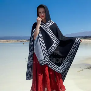 *Ladies Patterned Poncho With a Hood