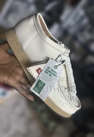Supreme X Clarks Wallabee Patent Leather Shoes.