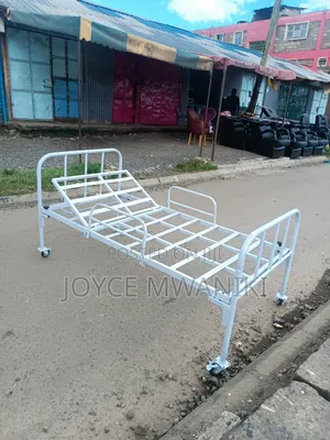 Hospital Bed With Caster Wheels and Coated White Frame