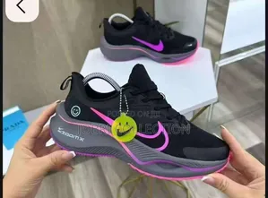 Ladies Black and Pink Nike Zoom X Sneakers