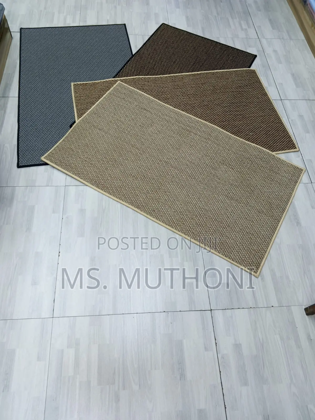 Solid Color Dirt Trapper Doormats Featuring a Non-Slip Backing.