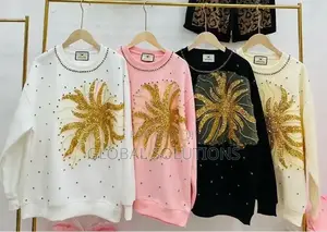 Sweatshirt With a Gold Sequin Starburst Design on the Front