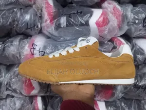 Alo Yoga Sunset Suede Sneakers in a Caramel Color.