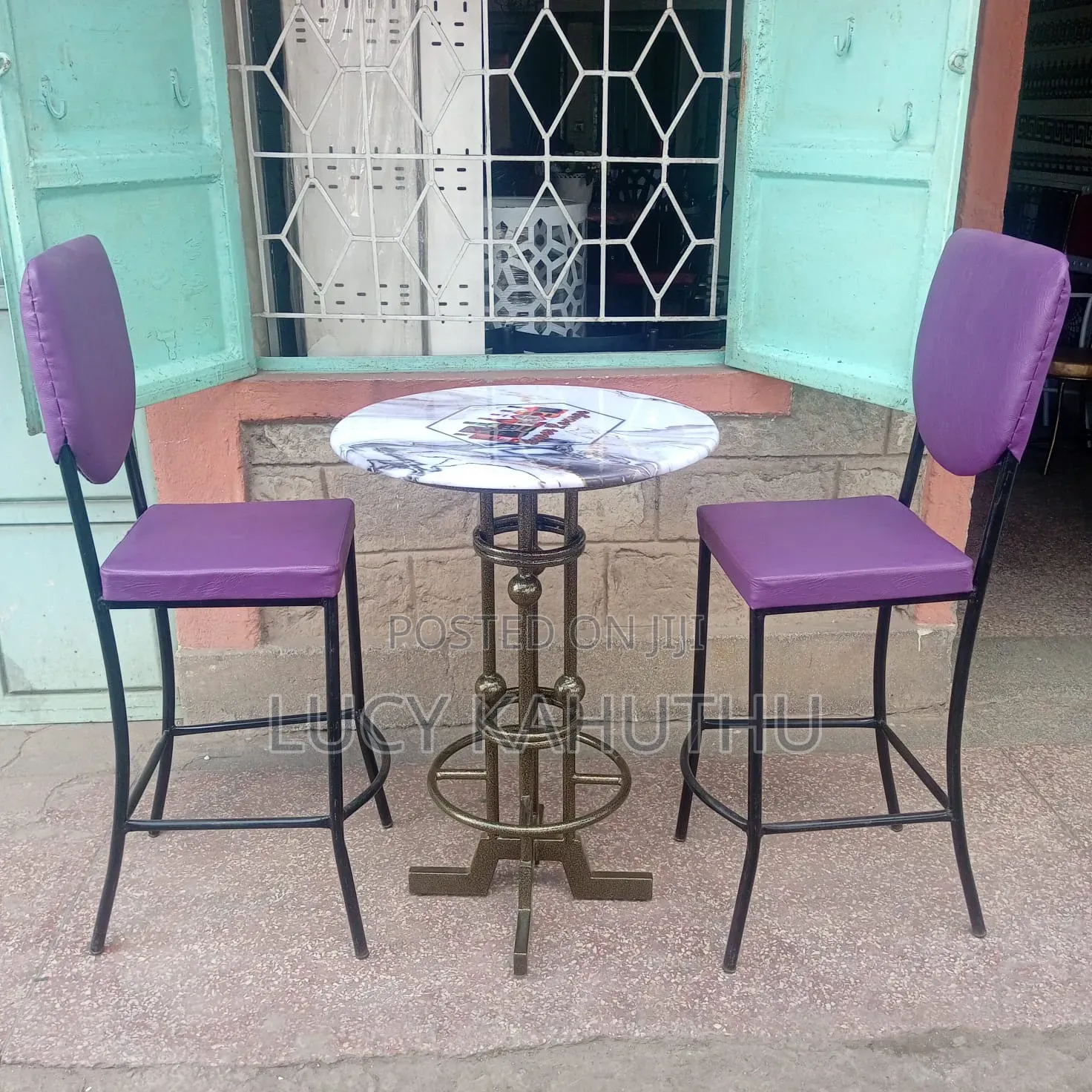 Two Purple Curved Restaurant Chairs With Table