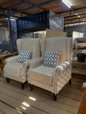 Elegant Beige Armchairs With Patterned Cushions