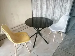 Round Black Table and Two Molded Chairs