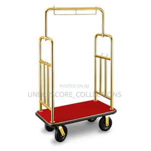 Golden Hotel Luggage Trolley With a Red Carpet Base.
