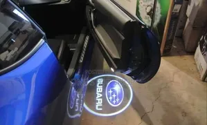 2pc Subaru Door Protector Light With Clear Vibrantlogo Image on Ground