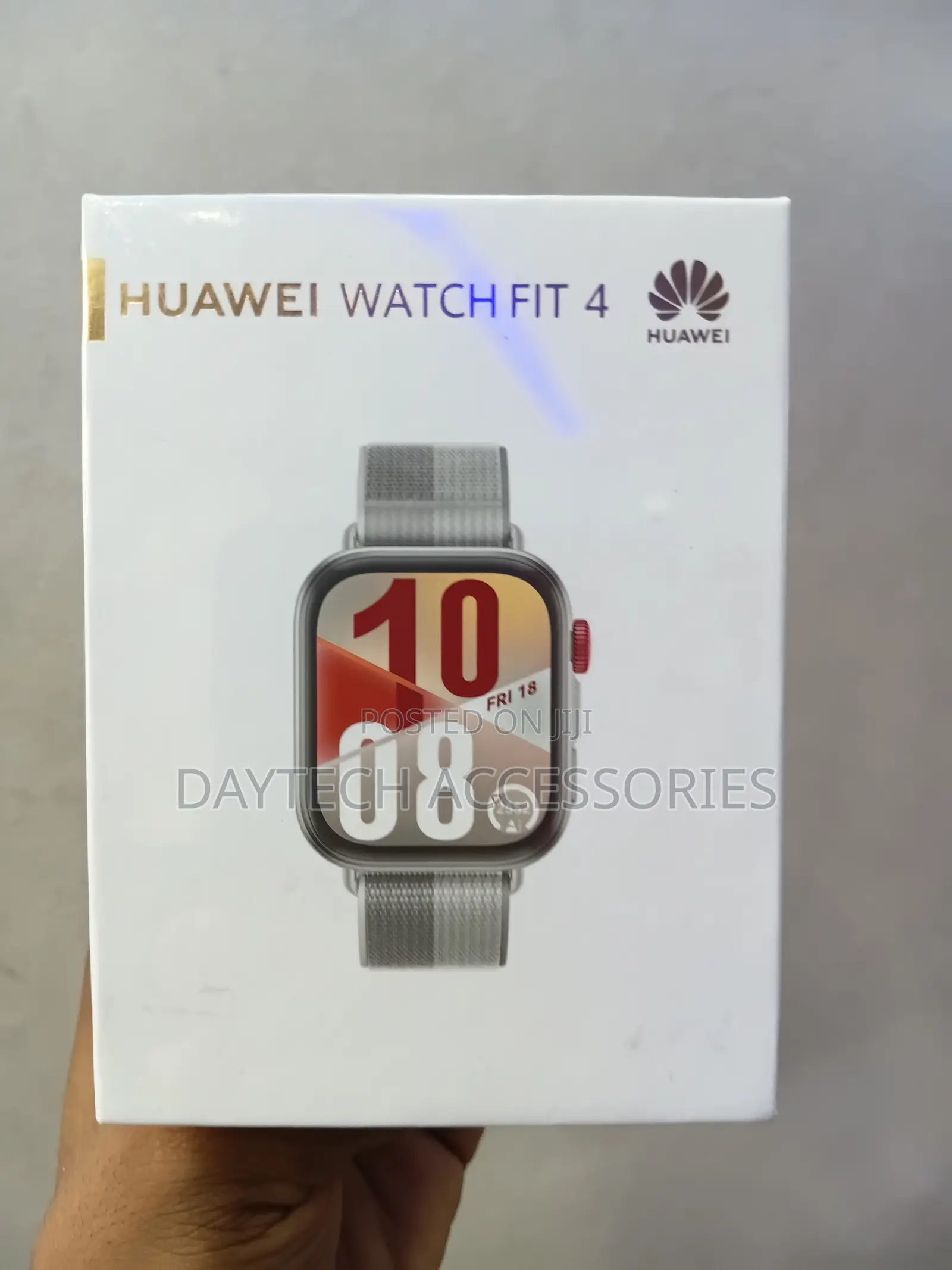 This Is a Huawei Watch Fit 4 Smart Watch With a Grey Strap.
