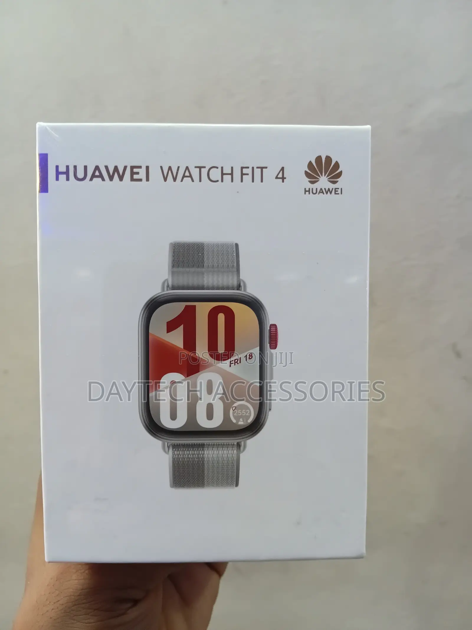 This Is a Huawei Watch Fit 4 Smart Watch With a Grey Strap.