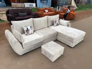 Spacious Beige Sectional Sofa With Matching Ottoman