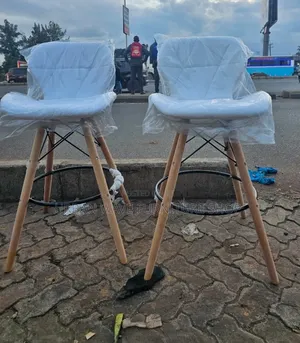 White  Padded Eams Counter Chairs