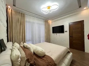 Gold Curtains and White Sheers With Hooks