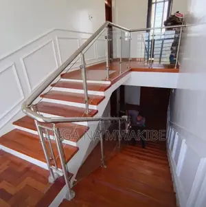 Chrome Piped Hand Rail Staircase With Glass Balustrade