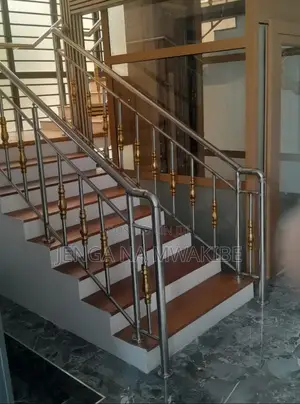 Chrome Piped Hand Rail Staircase With Glass Balustrade