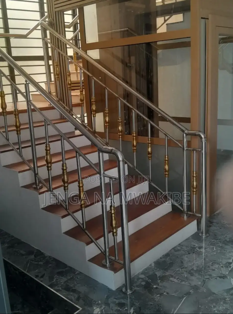 Chrome Piped Hand Rail Staircase With Glass Balustrade