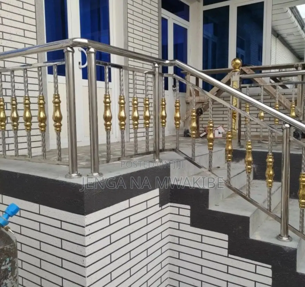 Chrome Piped Hand Rail Staircase With Glass Balustrade