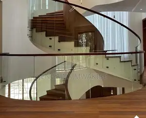 Clear Glass Balustrade And A Dark Wood Handrail Installation
