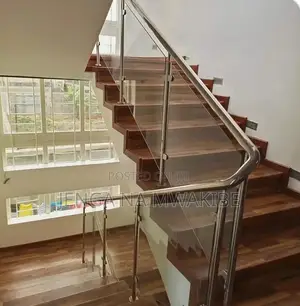 Clear Glass Balustrade And A Dark Wood Handrail Installation