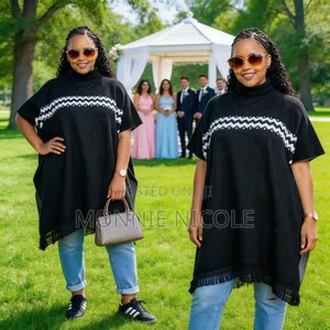 Black Tassel Poncho. Elegant Design